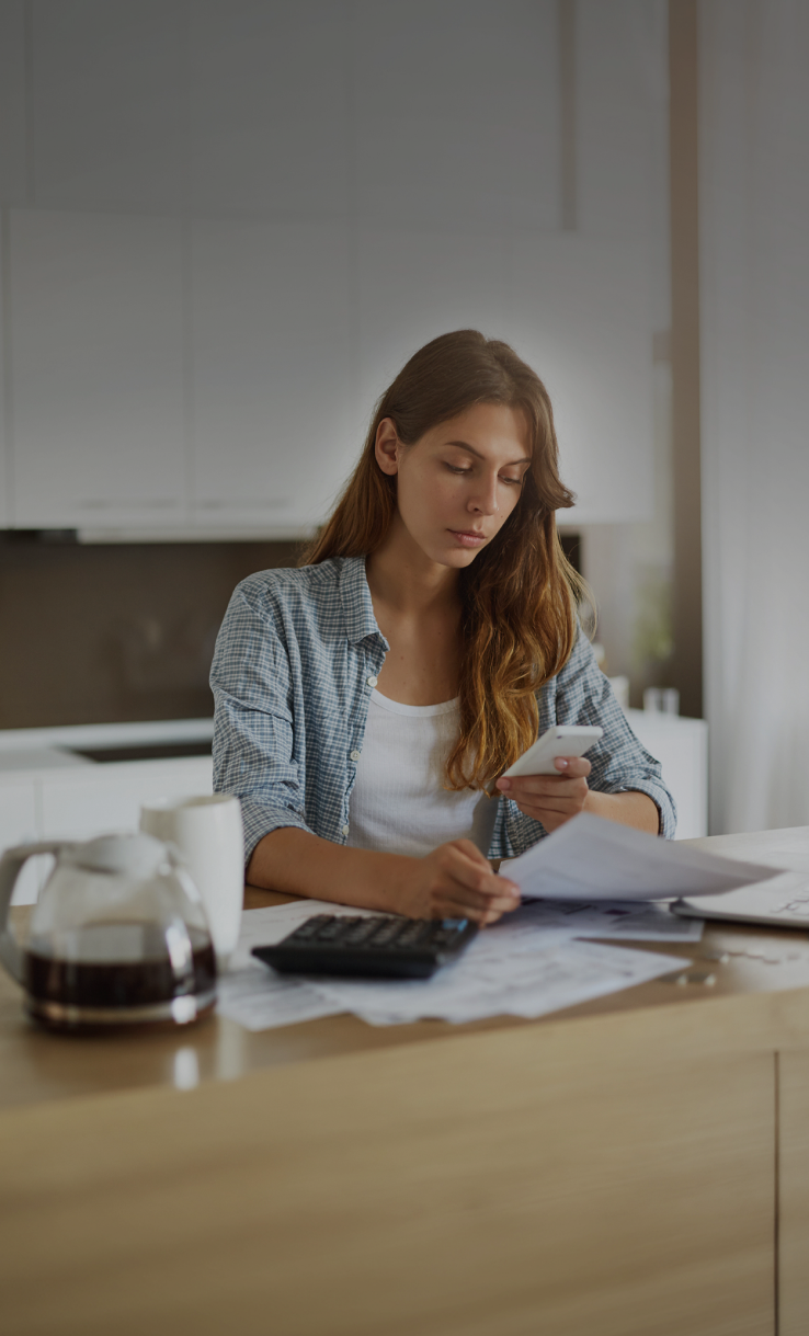 A business owner reviewing financial documents before contacting PragmaPay regarding financing